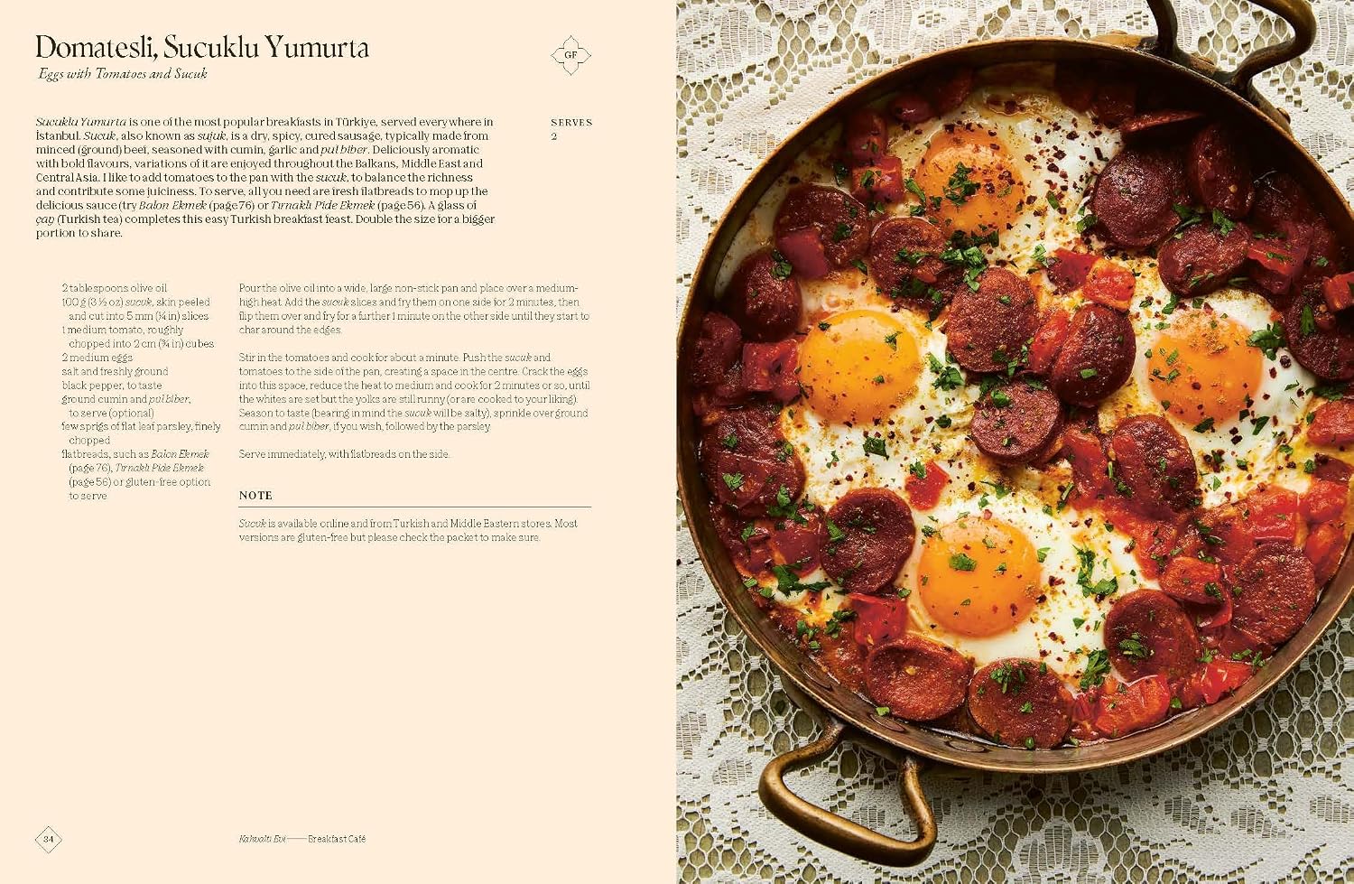 Pan with eggs and sausages on a lace tablecloth