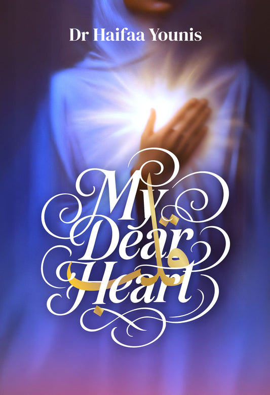 Book cover of 'My Dear Heart' by Dr. Haifaa Younis with a hand holding a heart.